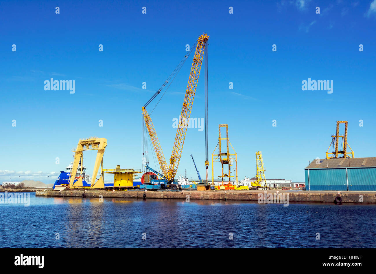 Heavy lifting cranes on the quayside at Leith Docks, Edinburgh. The