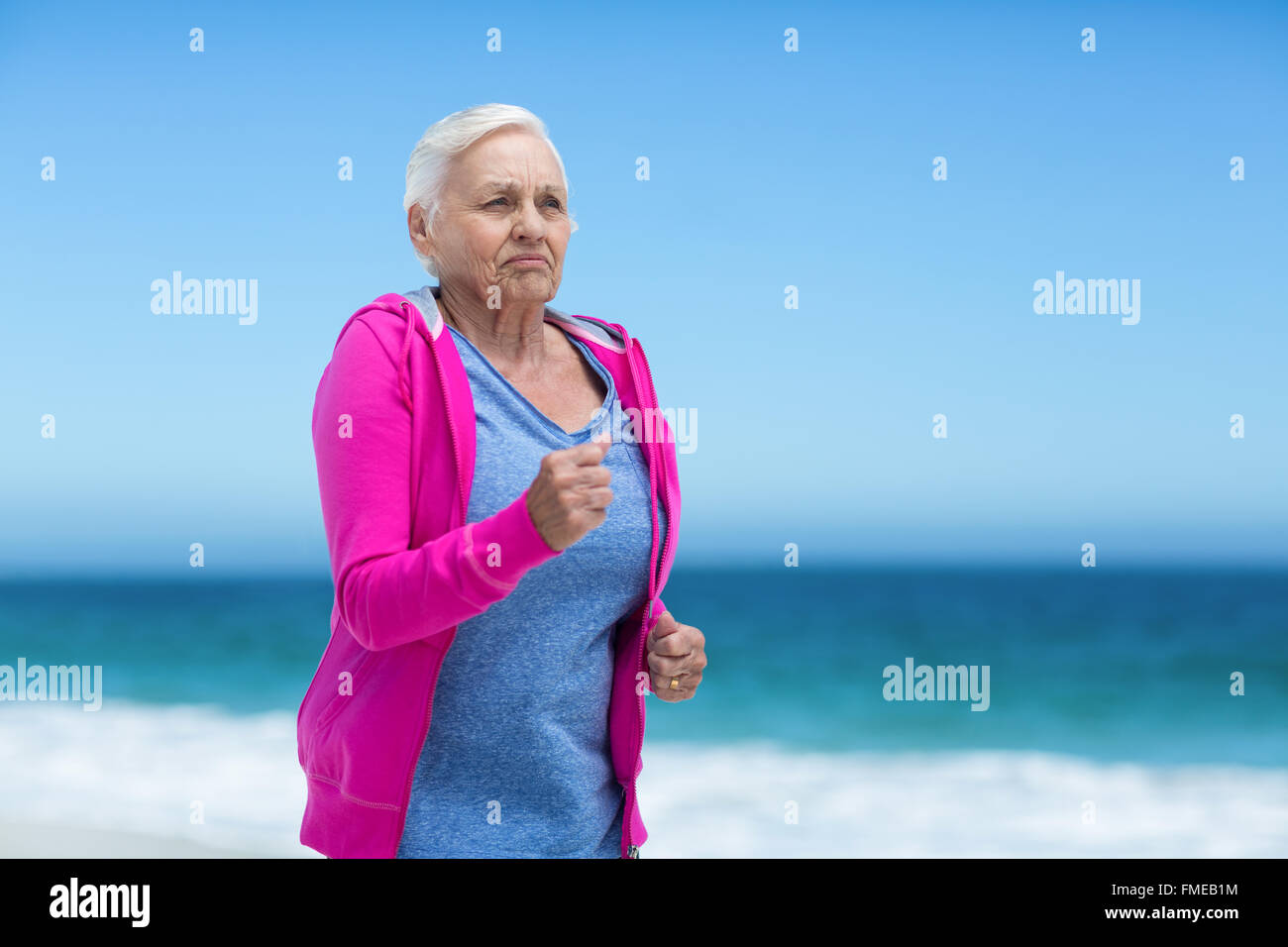 Focused Mature Woman Running Stock Photo Alamy