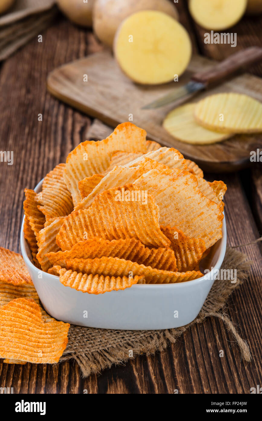 Bowl With Rippled Potato Chips Selective Focus On Wooden Background