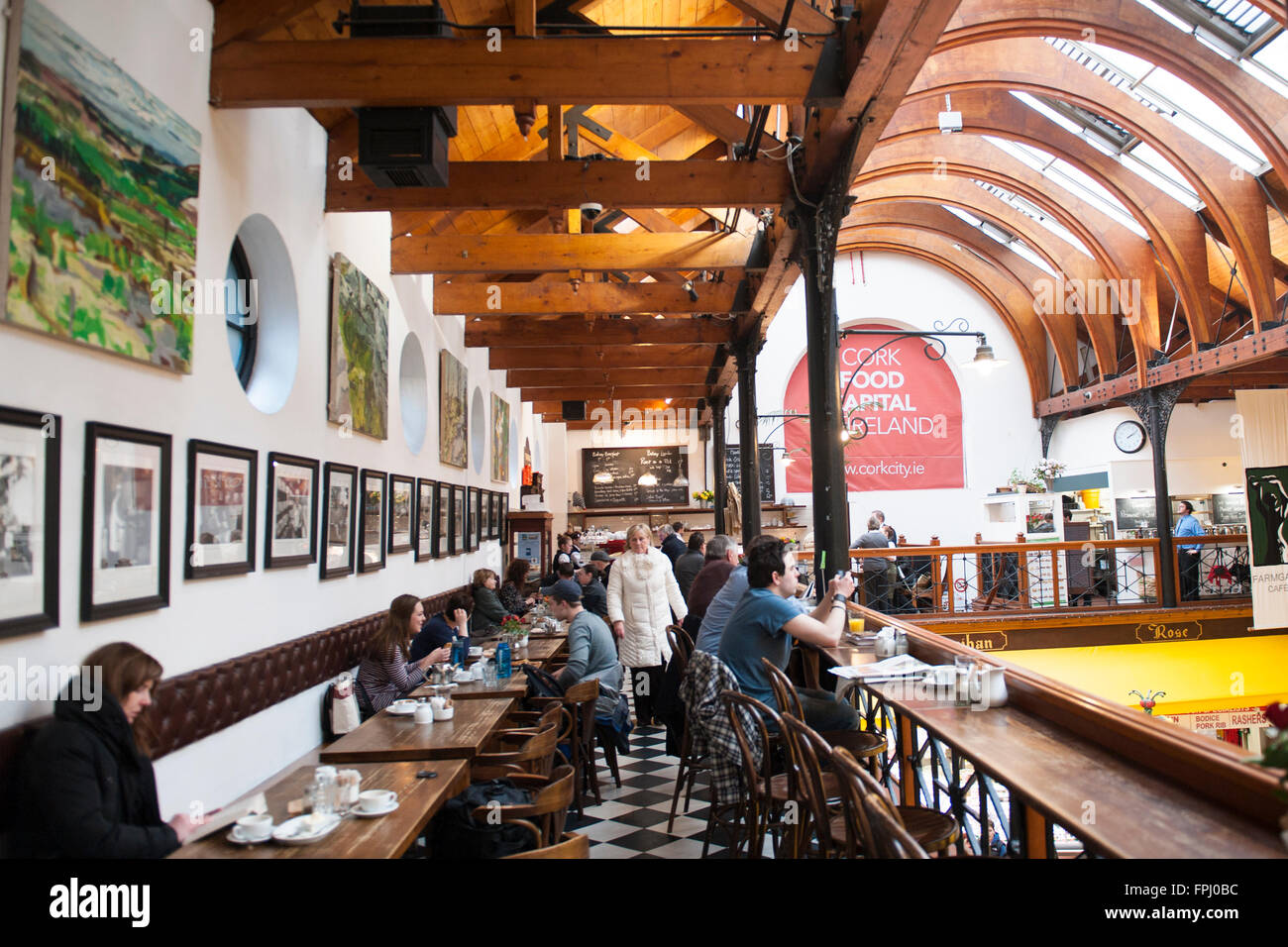 the farm gate restaurant with market stalls and shoppers beneath the farm gate restaurant with market stalls and shoppers beneath
