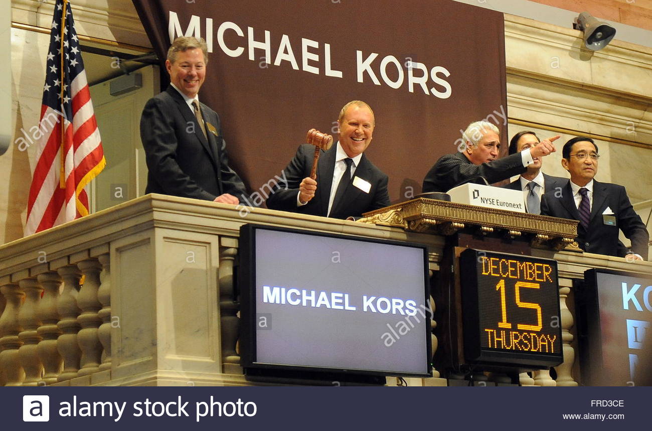 Fashion Designer Michael Kors (2-L) founder of Michael Kors Holdings Ltd.