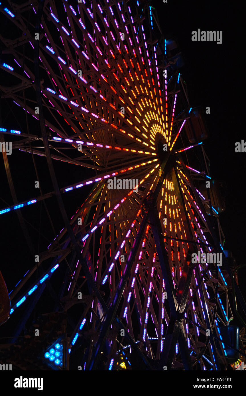 Night time lights of midway ride at the Dutchess County Fair Stock