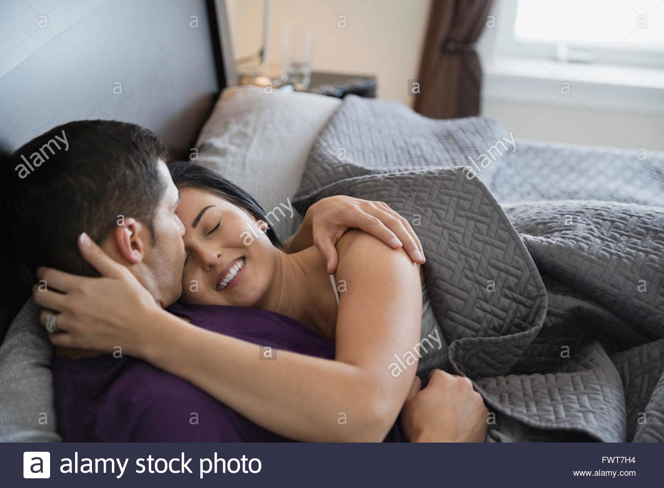 Romantic Couple Kissing And Embracing In Bed Stock Photo 101951056 Romantic Couple Kissing And Embracing In Bed