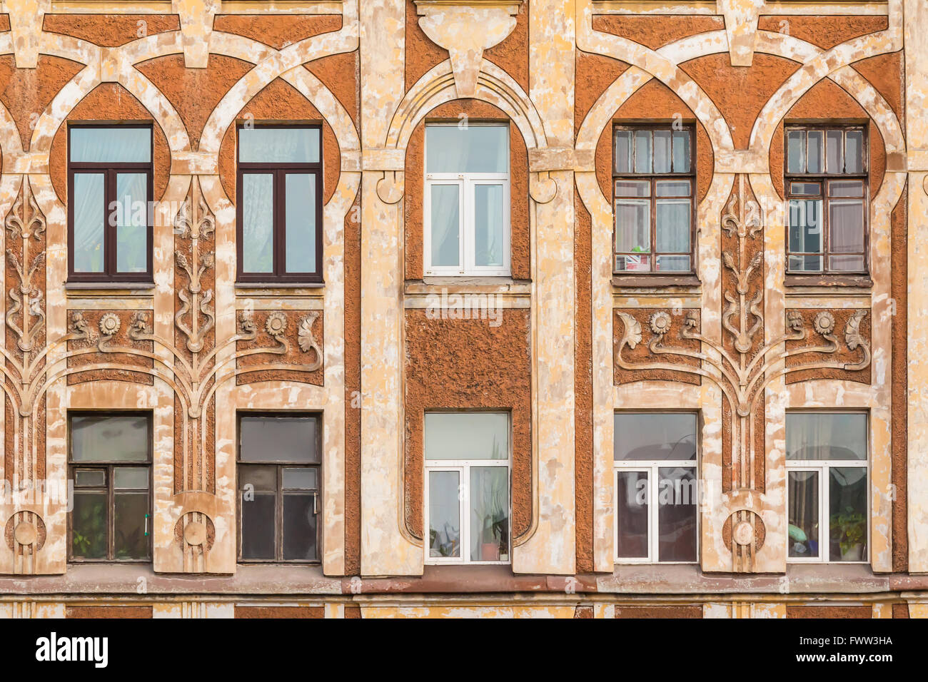 Apartment Building Front several windows in row on facade of urban apartment building front Apartment Building Front several windows in row on facade of urban apartment building front