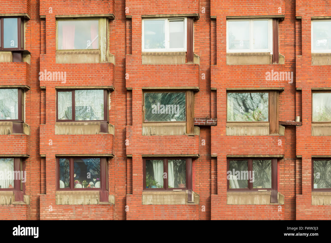 Apartment Building Front several windows in row on facade of urban apartment building front Apartment Building Front several windows in row on facade of urban apartment building front
