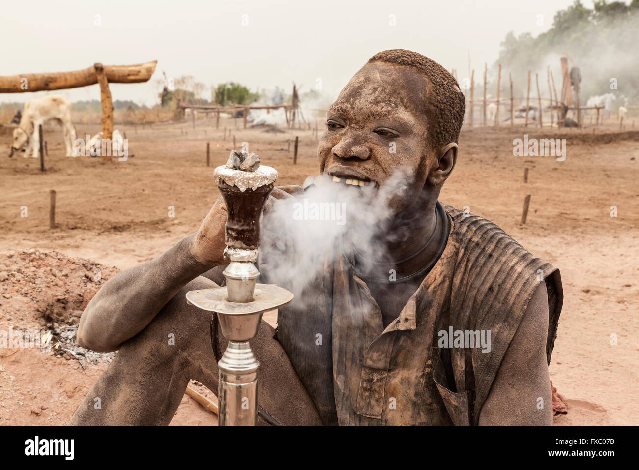 South Sudan. 21st Feb, 2016. A Mundari man covered in ash from the