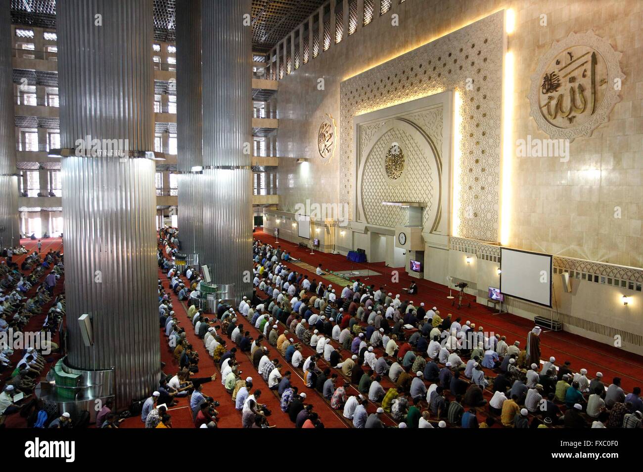 Muslims pray during Friday prayer service at Istiqlal Mosque. (Photo