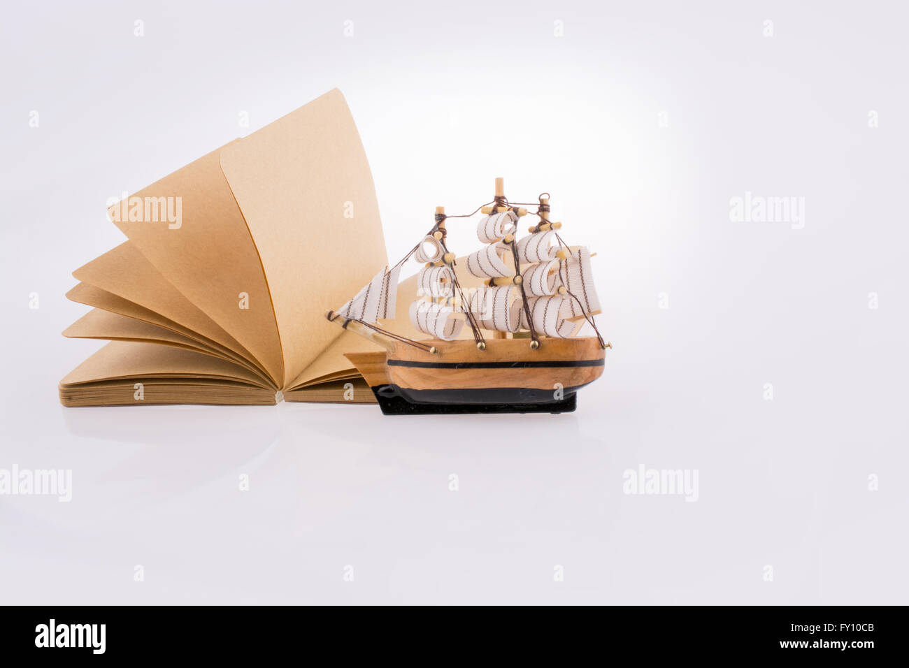 Old Ship On A Notebook On A White Background Stock Photo Royalty