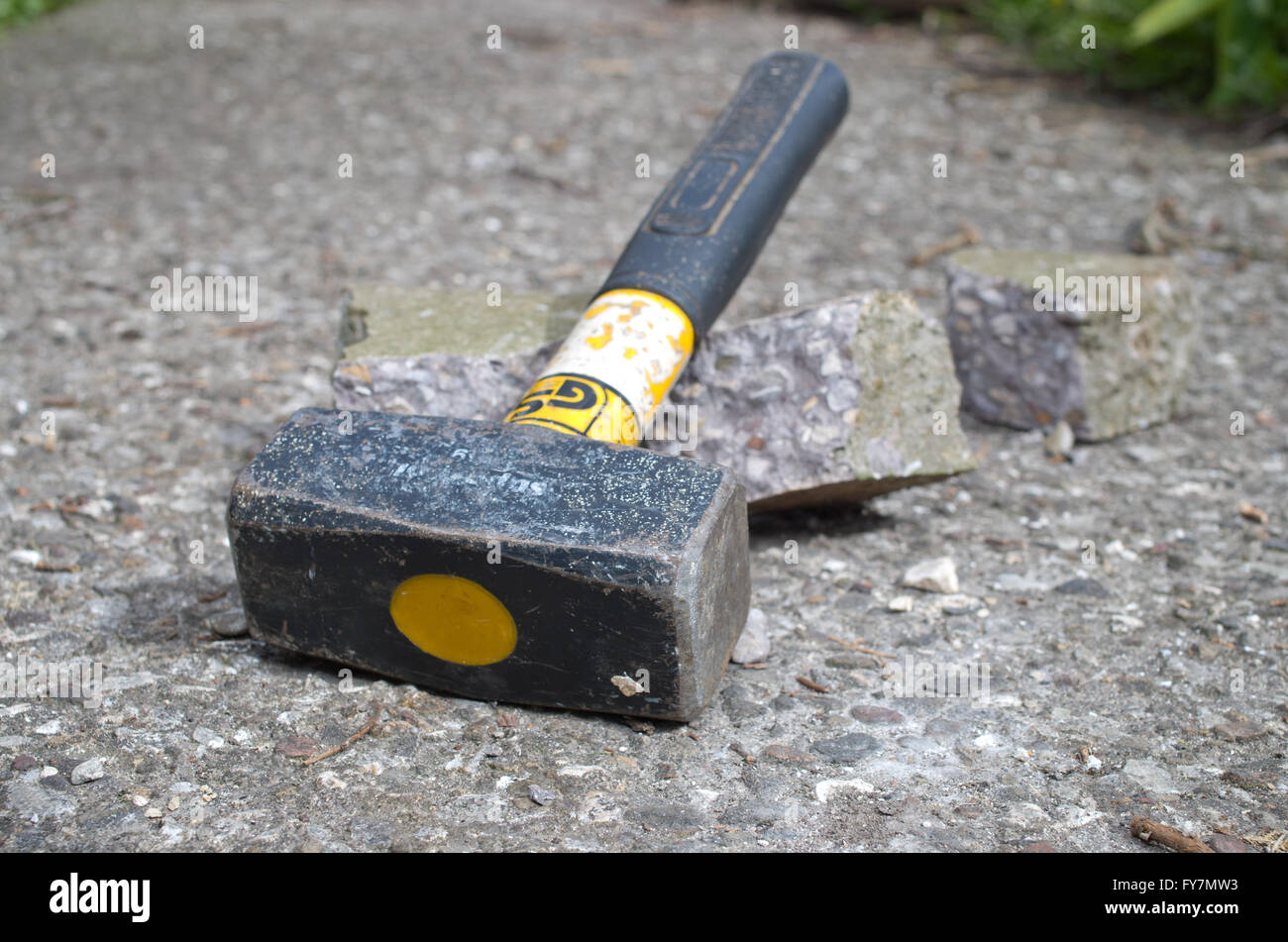 Lump hammer used to break up concrete Stock Photo, Royalty Free Image
