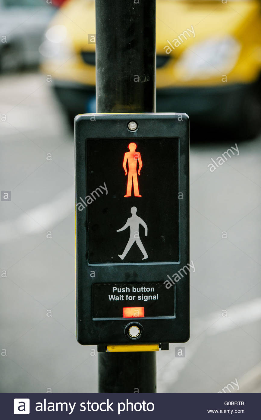 Push button and wait for signal traffic sign UK Stock Photo, Royalty