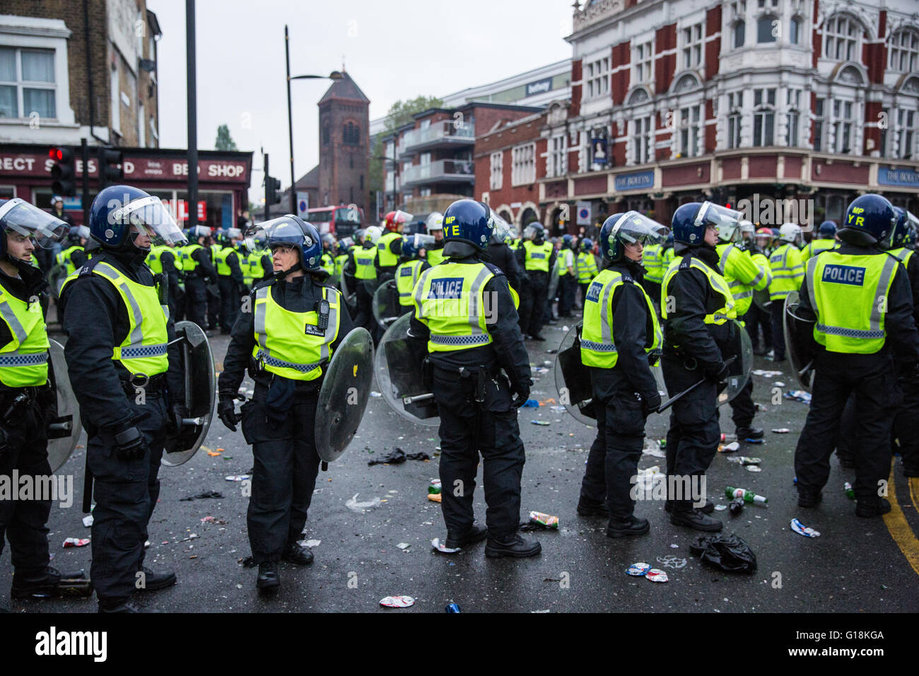 London, UK. 10th May, 2016. Riot police confine West Ham supporters