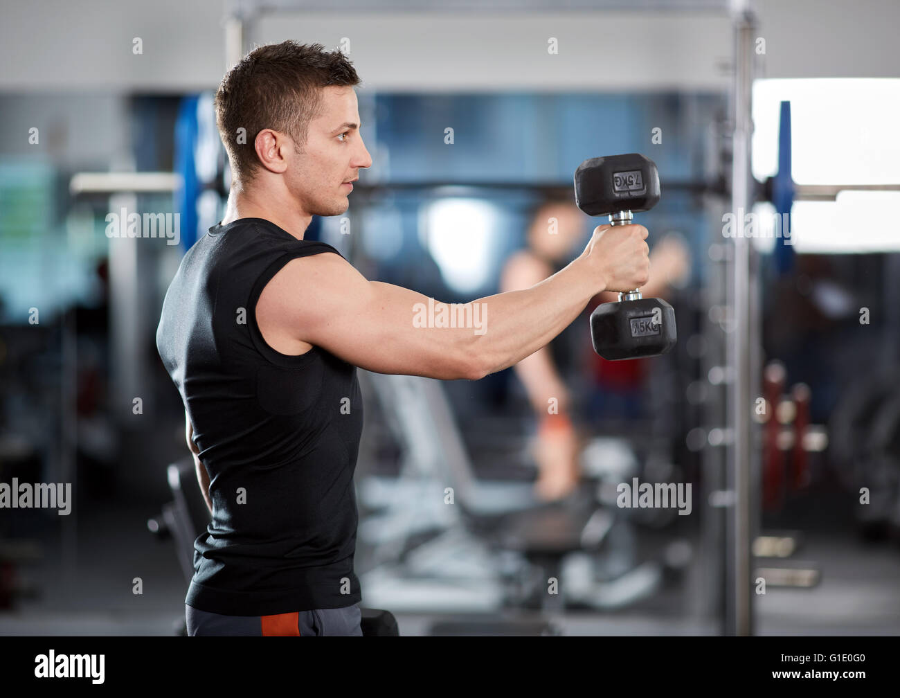 Man Doing Shoulder Workout With Dumbbells In The Gym Stock Photo Alamy