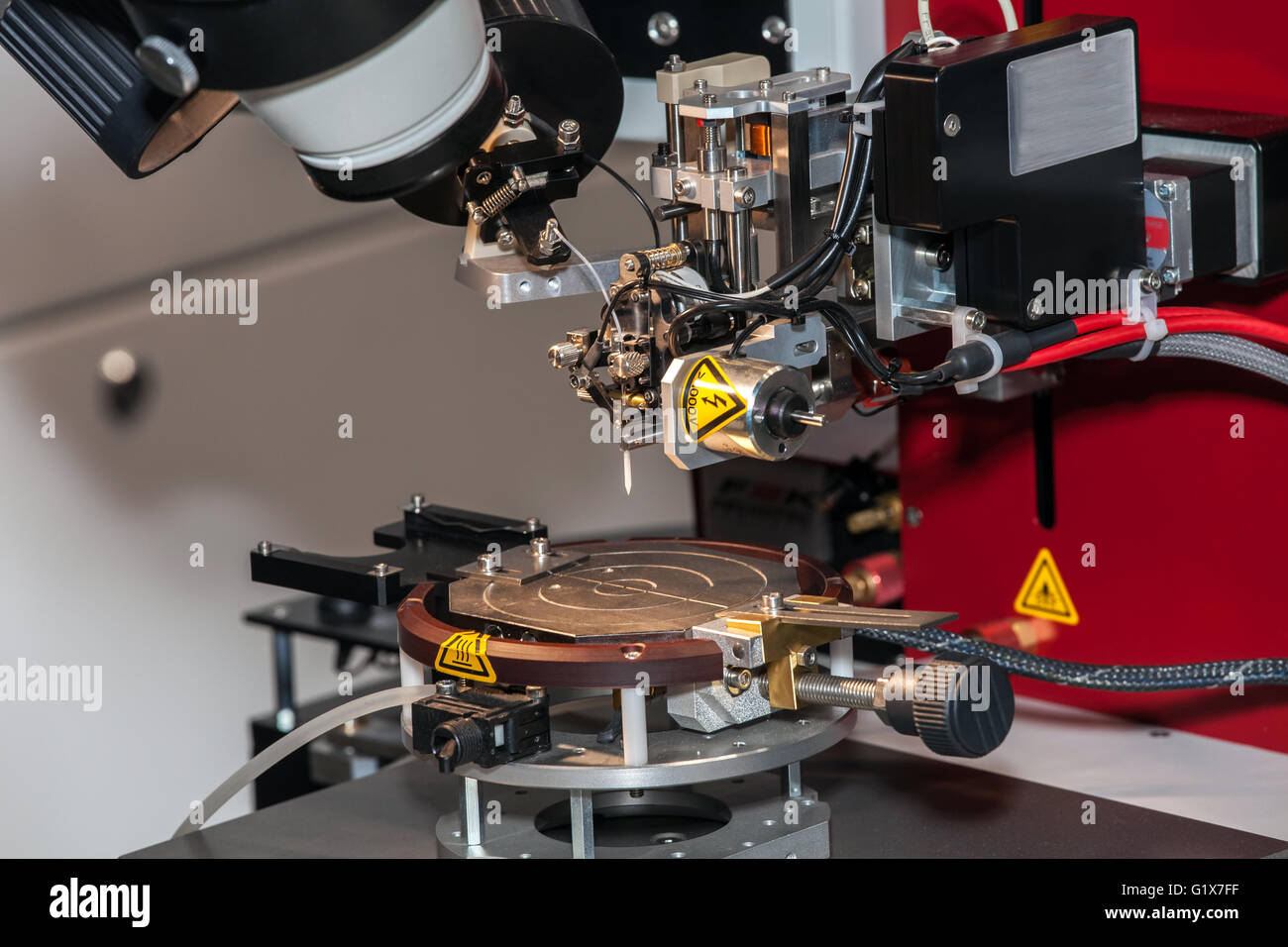 Wire bonding machine close up process Stock Photo, Royalty Free Image