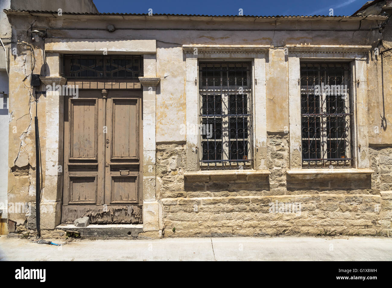 Wooden doors and windows with bars in the old building in old town ... Wooden doors and windows with bars in the old building in old town ...