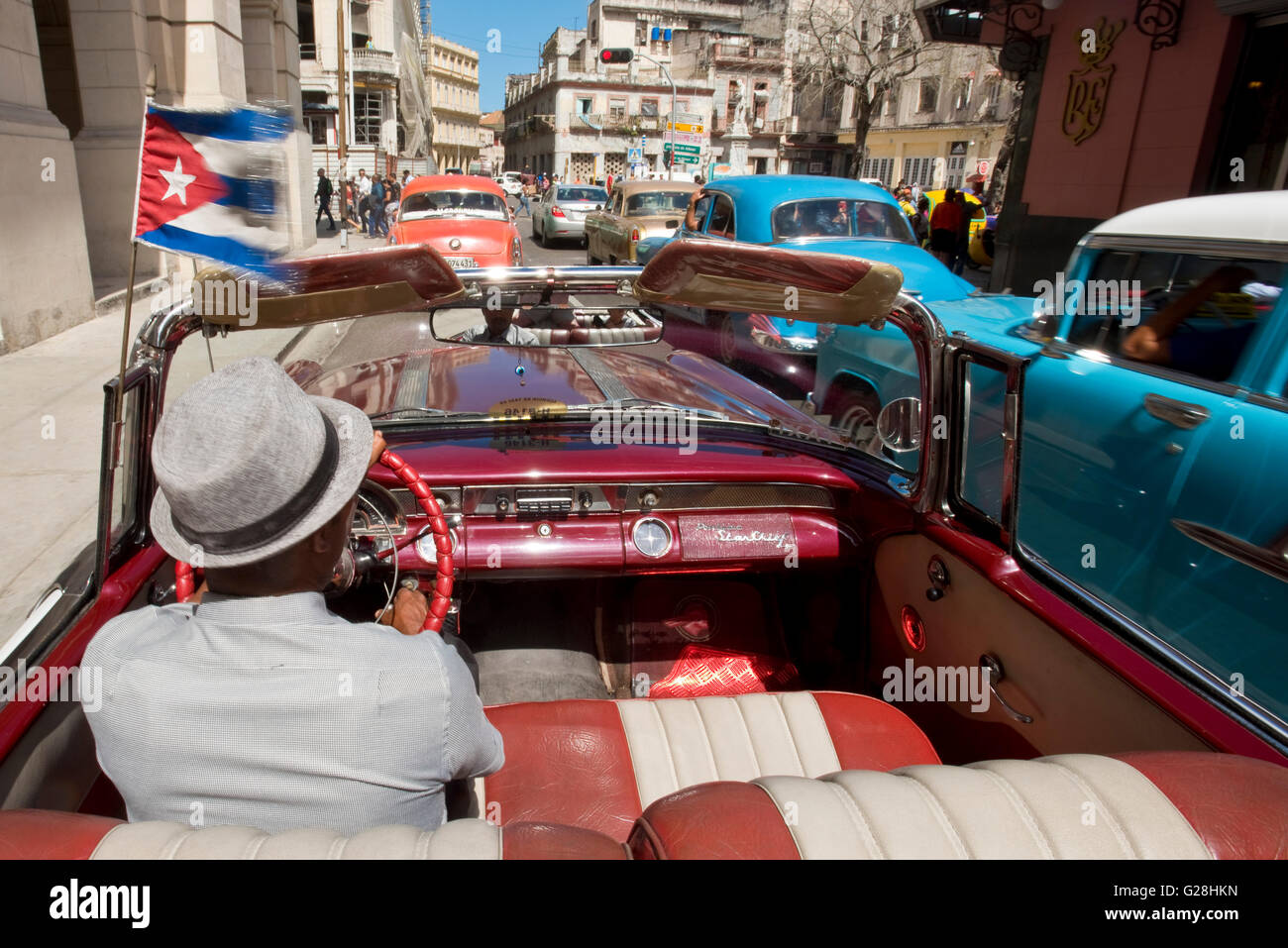 A Cuban Taxi Driver Driving His Pontiac Star Chief Convertible In