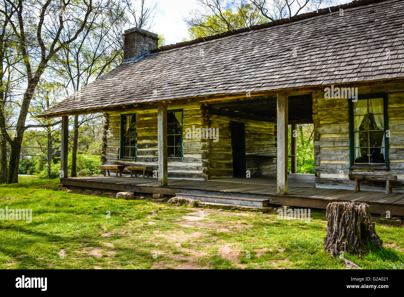 A Charming Rustic Log Cabin With Front Porch And Seats In 19th Century Style Is Beautiful Simplistic Pane Glass Windows A Charming Rustic Log Cabin With Front Porch And Seats In 19th Century Style Is Beautiful Simplistic Pane Glass Windows