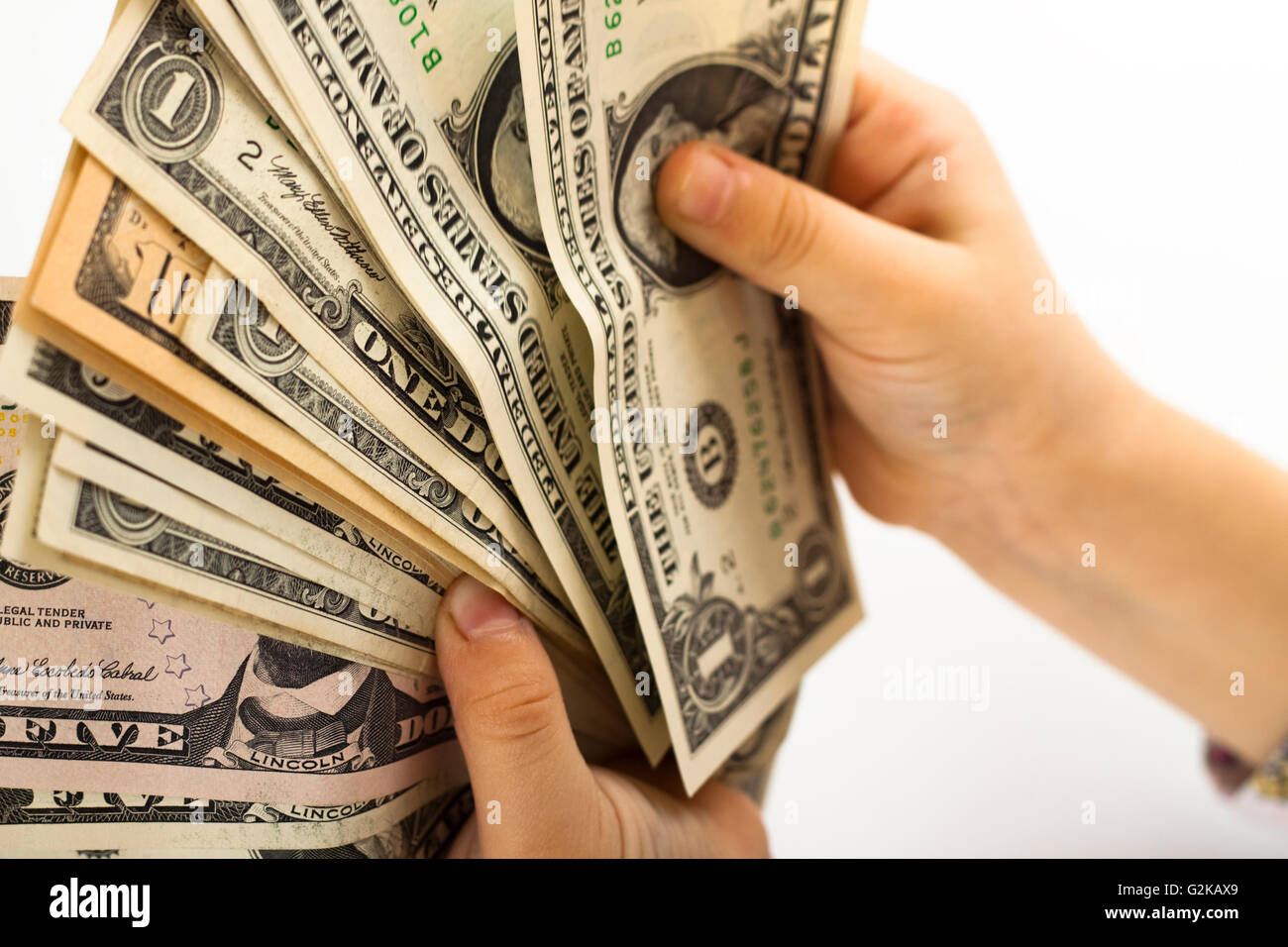 worksheet Counting Dollar Bills child holding and counting dollar bills on white background stock photo background