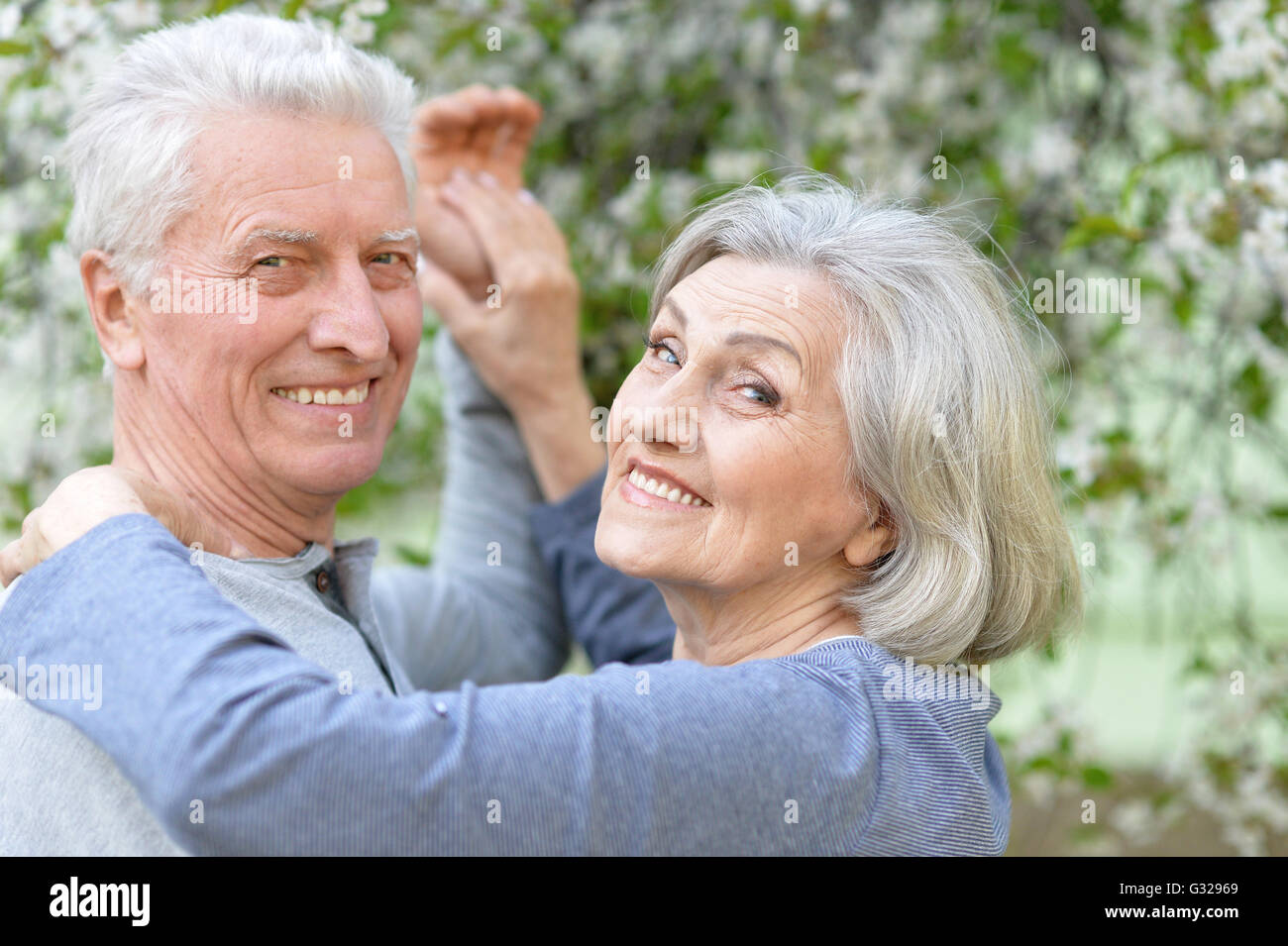 Mature Couple In Spring Park Stock Photo Alamy