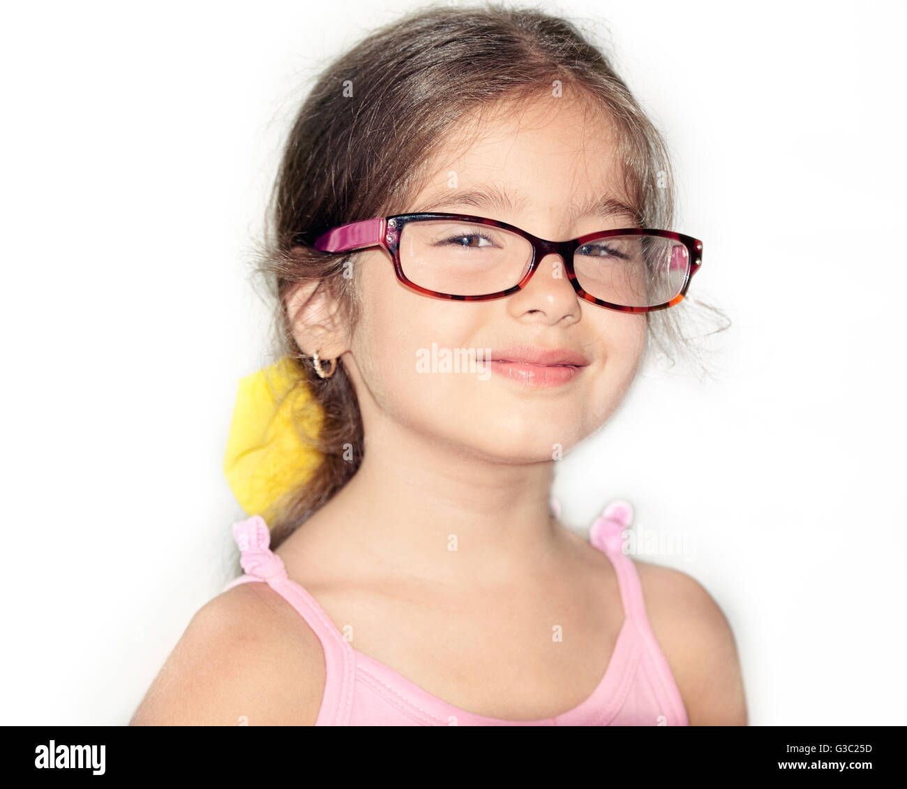 Smiling little girl wearing eyeglasses Stock Photo, Royalty Free Image