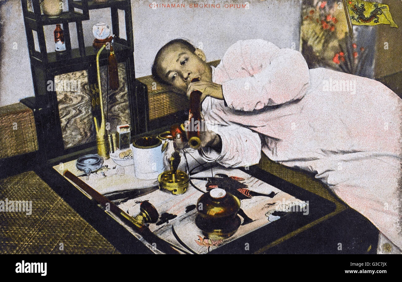 Chinese man smoking Opium, China Date circa 1910s Stock Photo, Royalty