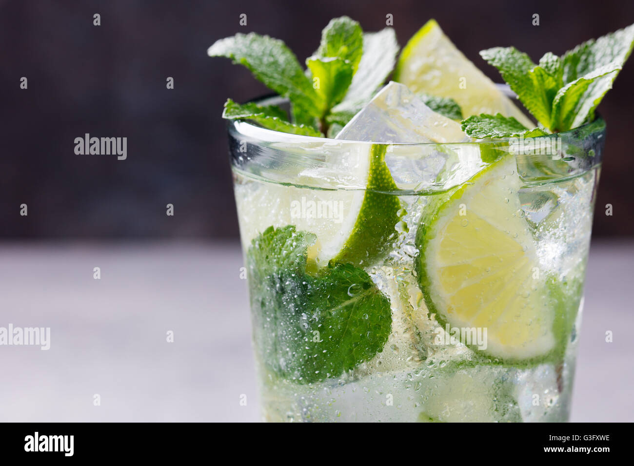 Mojito cocktail with lime, mint in highball glass Stock Photo, Royalty