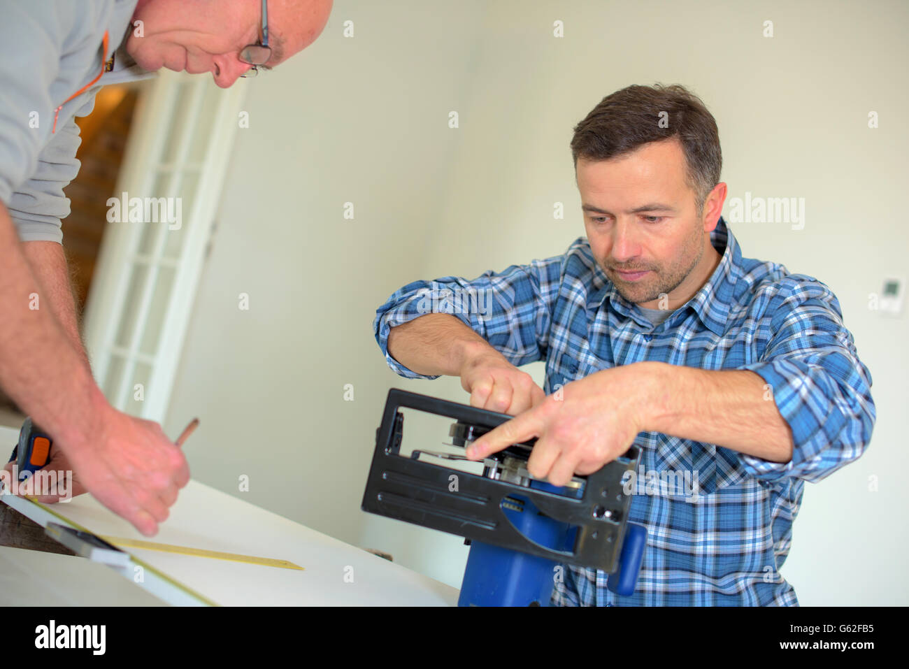 Carpenter Setting Up A Circular Saw Stock Photo Alamy