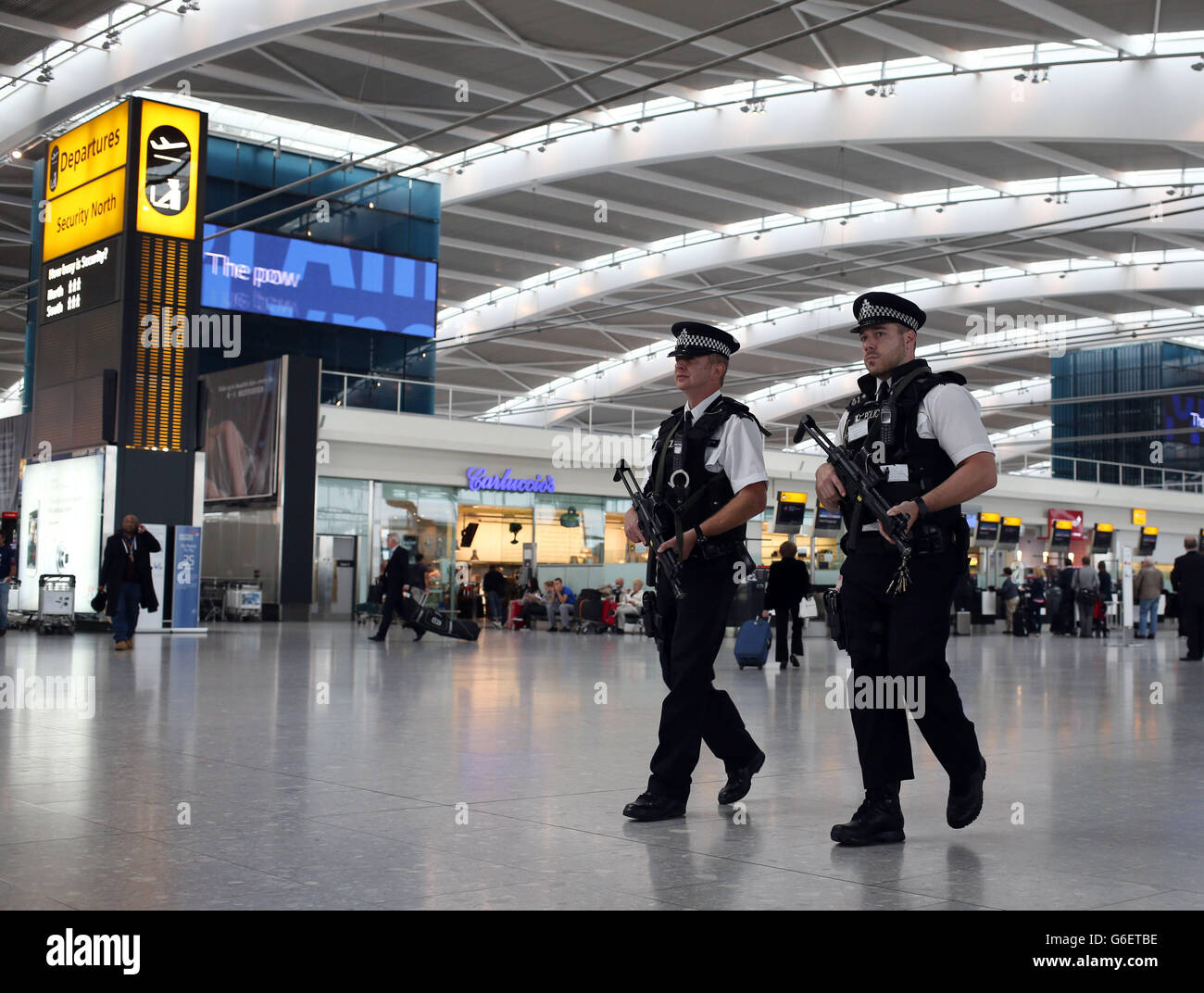 Armed police patrol at Heathrow Airport Stock Photo, Royalty Free Image