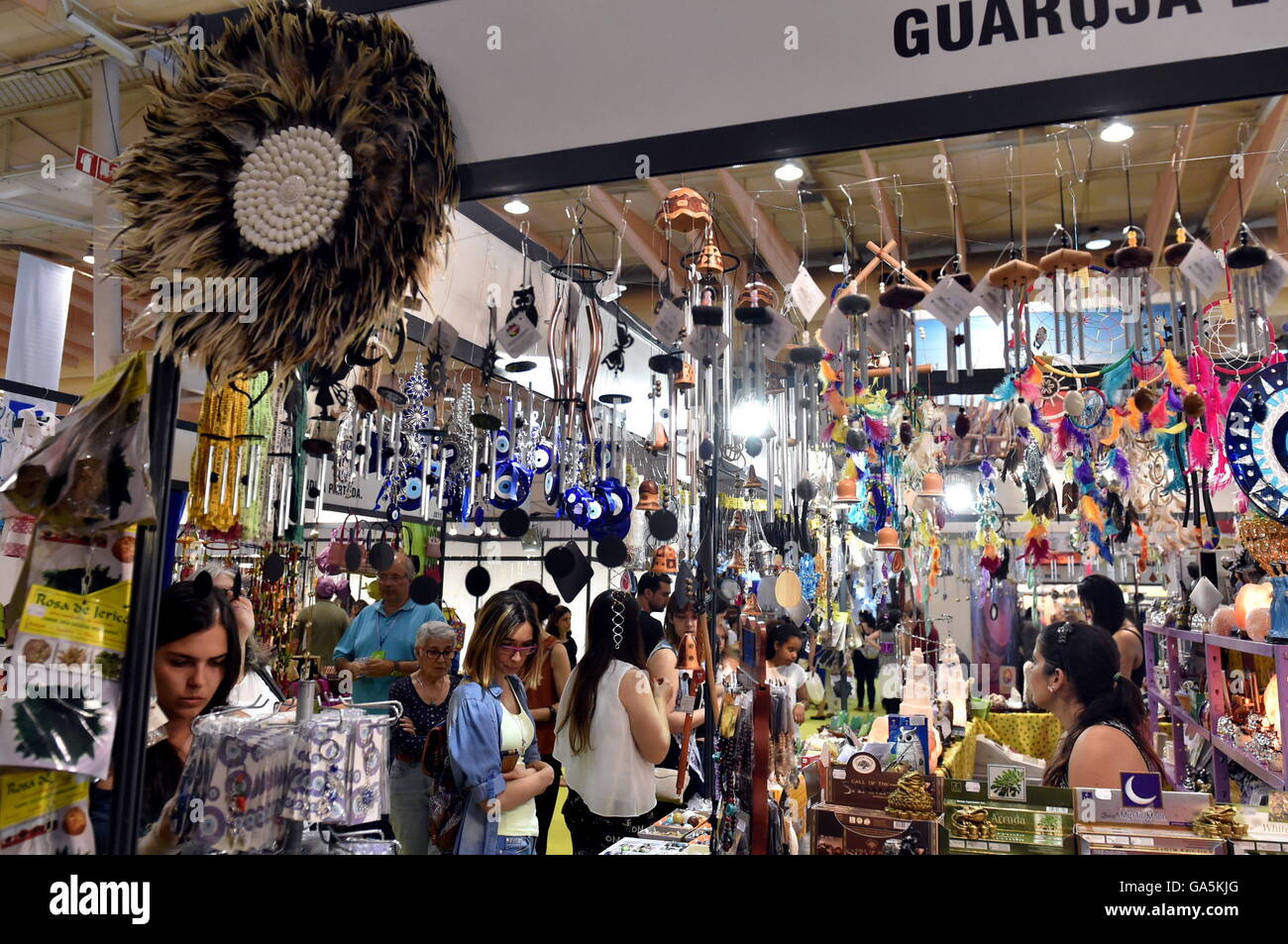 Lisbon, Portugal. 3rd July, 2016. Visitors watch handicraft works Stock Photo, Royalty Free