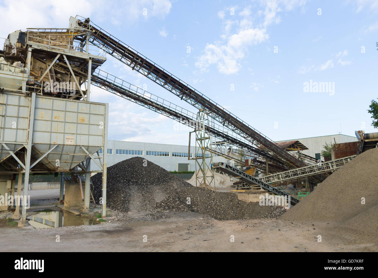 Stone quarry with silos and conveyor belts. Industrial equipment Stock
