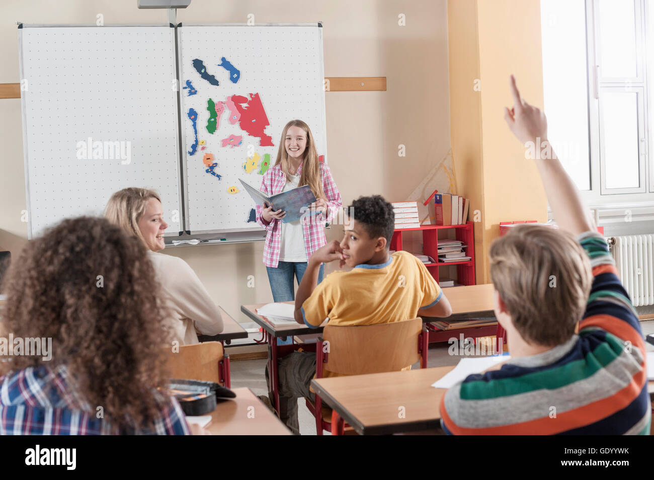 University student giving presentation in classroom, Bavaria, Germany