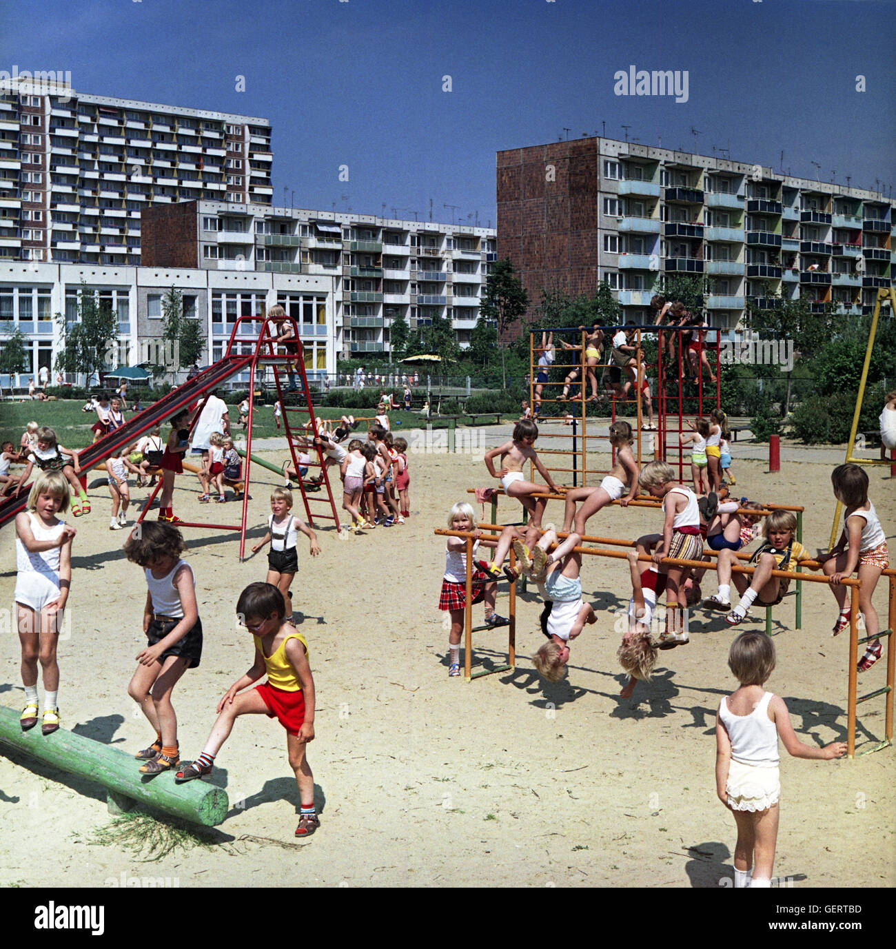 Rostock, DDR, kindergarten Children playing in a playground Stock Photo