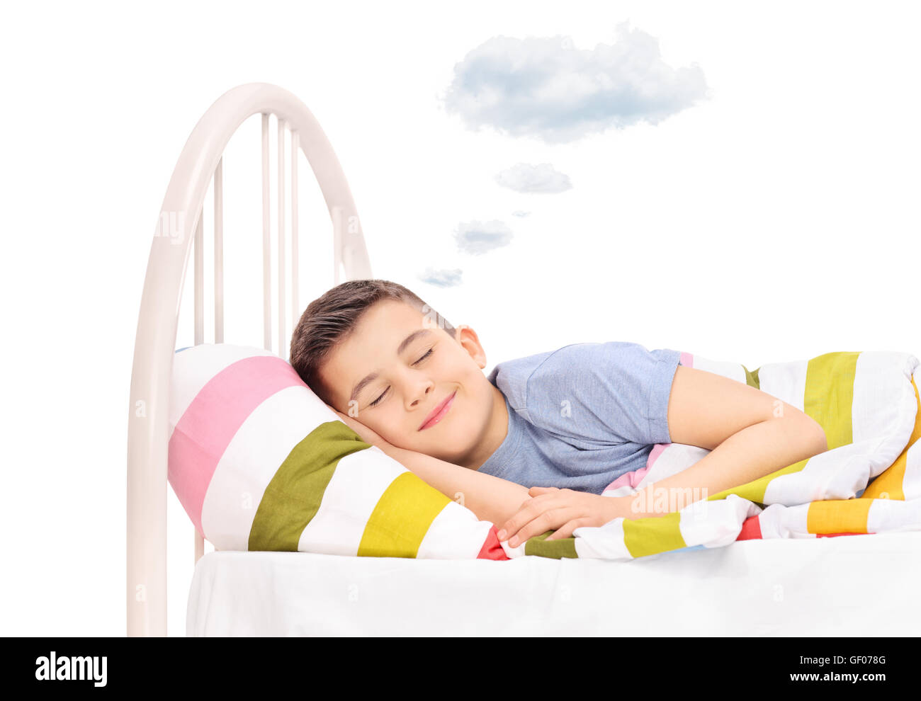 Happy boy sleeping and dreaming sweet dreams with a cloud above his