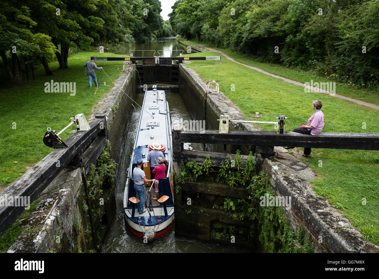 Narrow boat entering lock on and Avon Canal in Wiltshire Stock