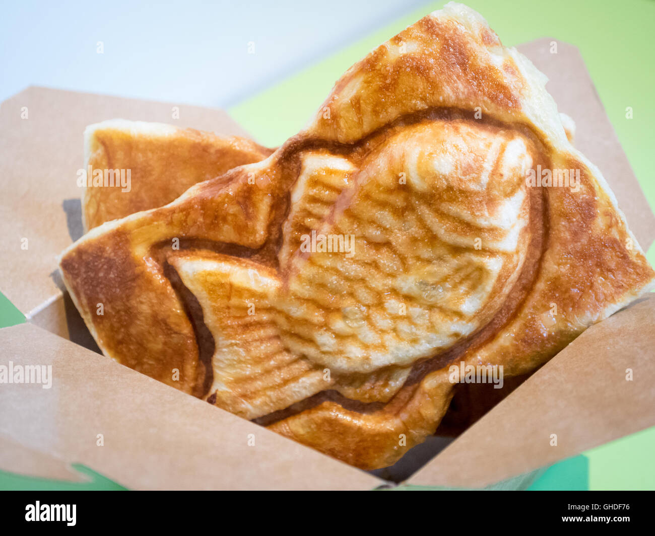 A taiyaki, a Japanese fishshaped cake filled with red bean paste Stock