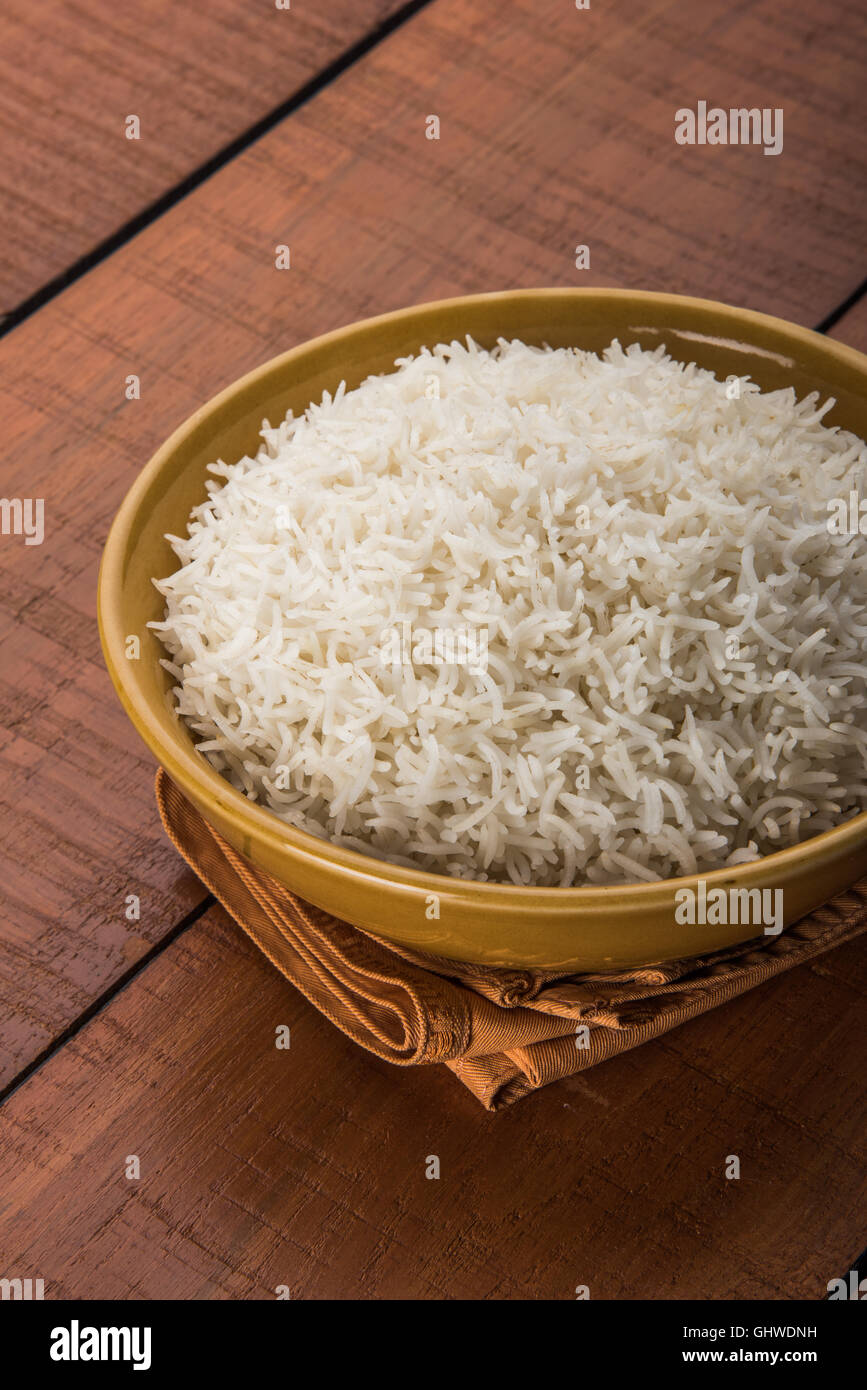 basmati rice in a brass bowl, cooked basmati rice, cooked plain rice
