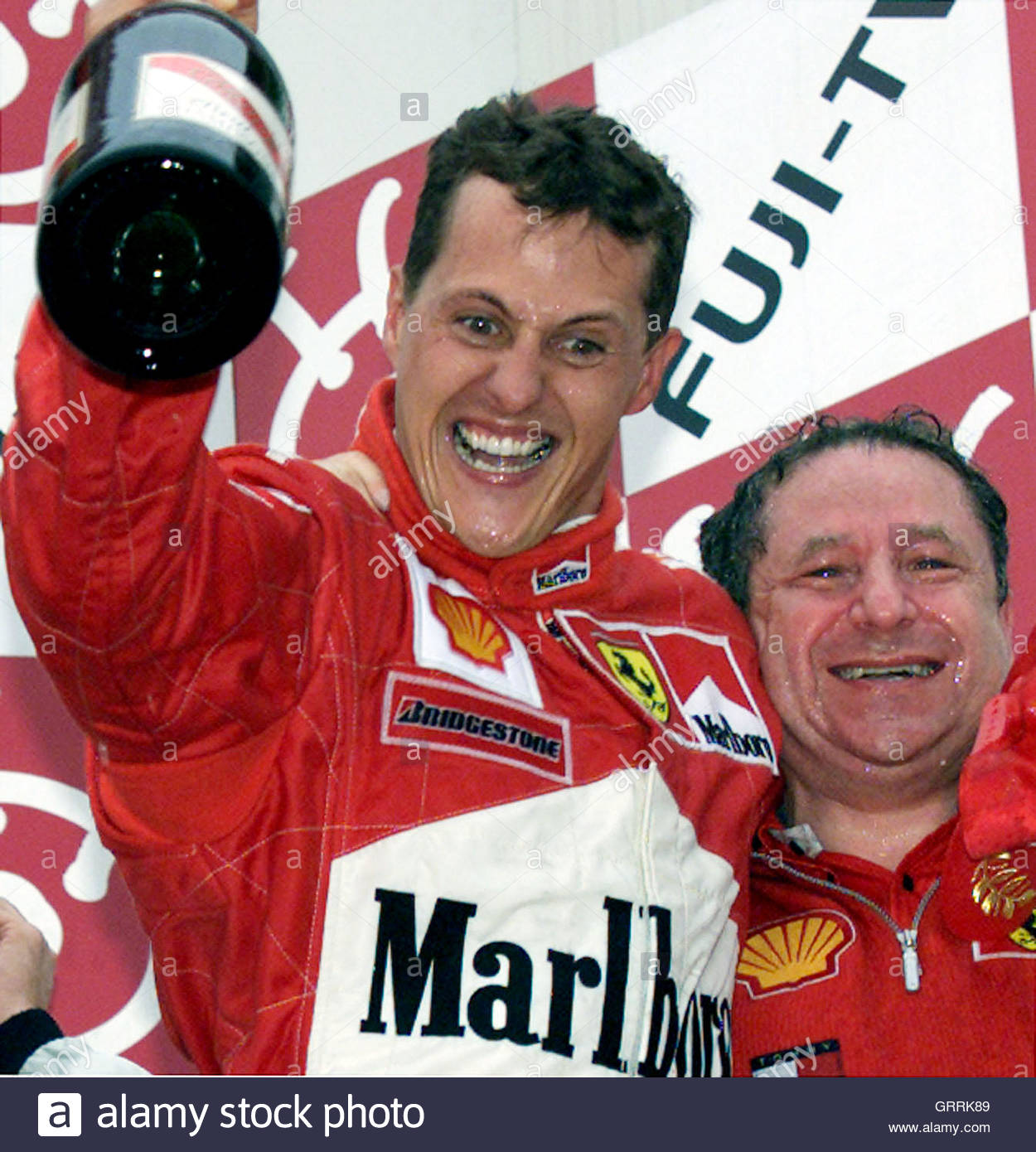 germanys-michael-schumacher-raising-a-bottle-of-champagne-reacts-to-GRRK89.jpg