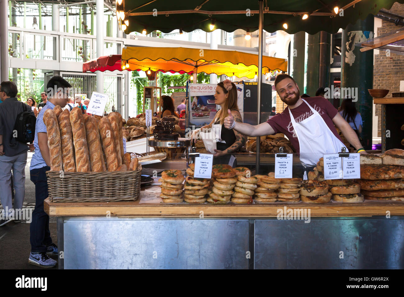 A vendor at the Bread Ahead stall at Borough Market, Southwark, South
