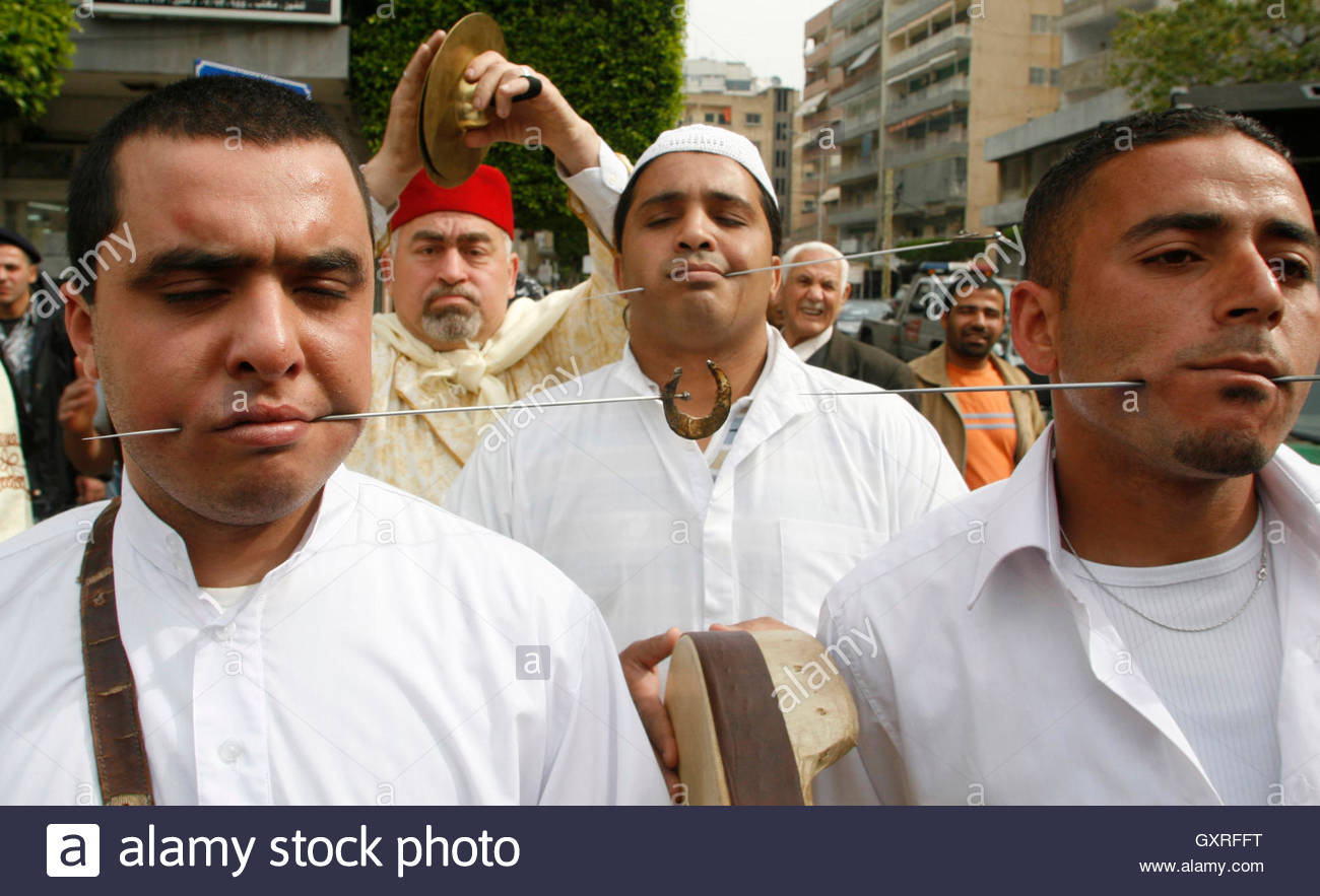lebanese-sufi-men-pierce-their-mouths-with-a-skewer-during-a-ritual-GXRFFT.jpg