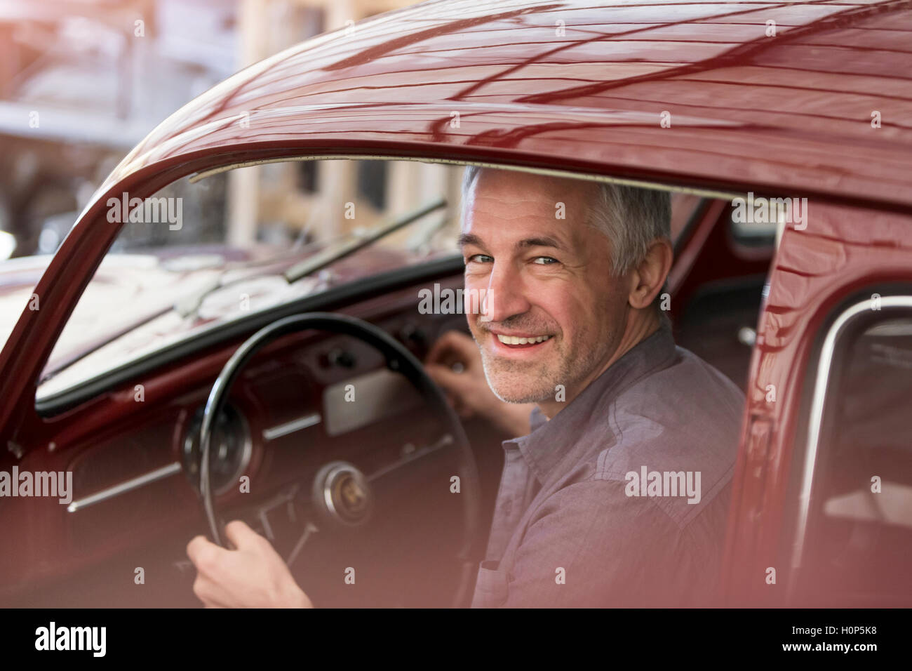 Portrait Confident Mature Man Sitting Workshop Hi Res Stock Photography