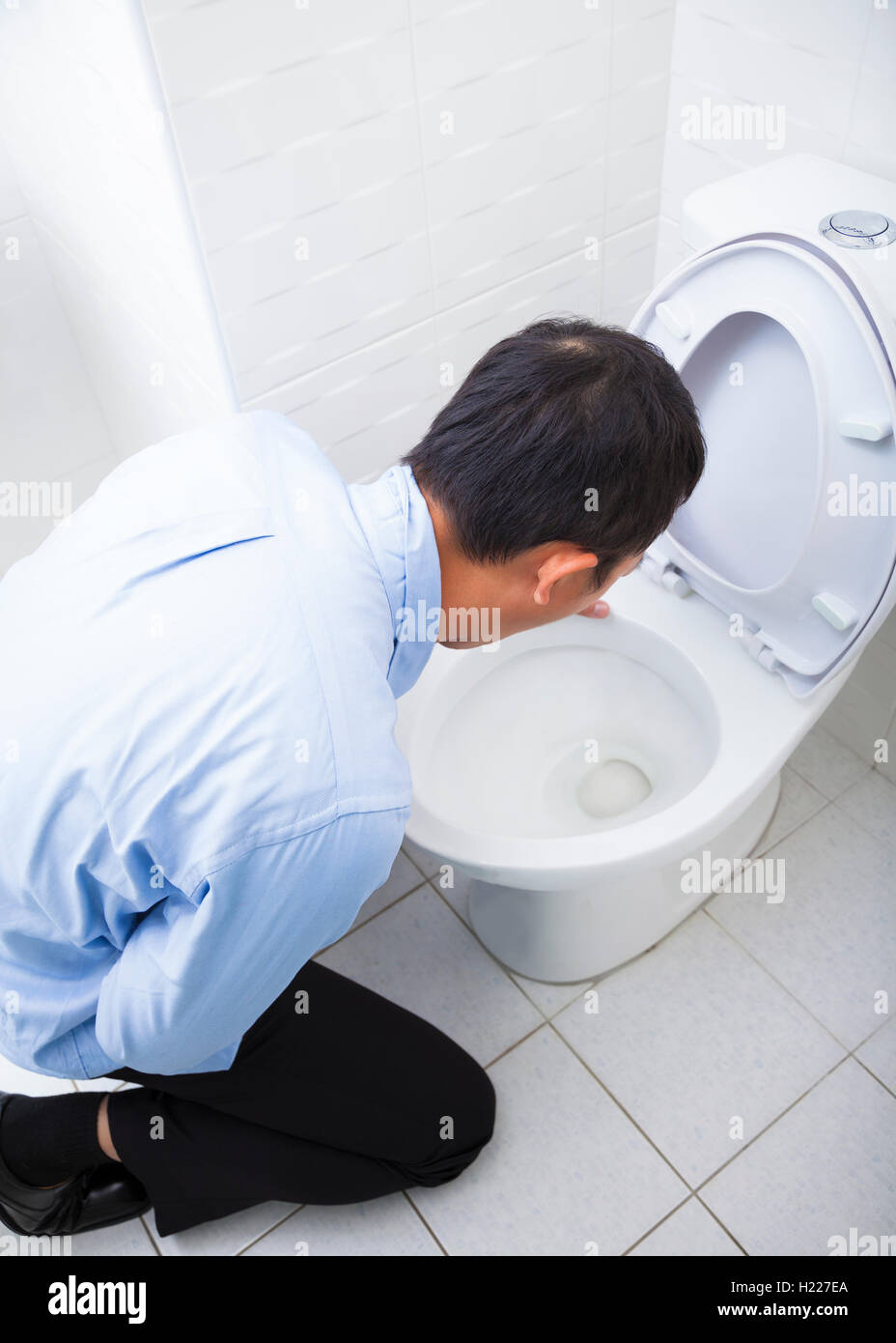 Young man drunk or sick vomiting Stock Photo, Royalty Free Image