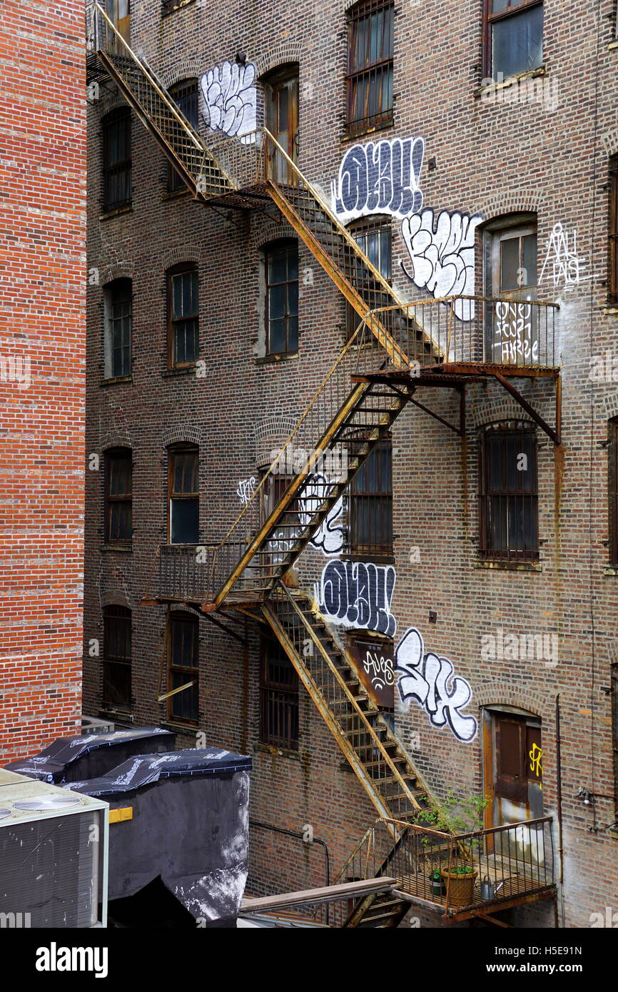 Fire escape and graffiti on the wall of an old apartment building ... Fire escape and graffiti on the wall of an old apartment building, Chelsea, New York City, NY, USA Fire escape and graffiti on the wall of an old apartment building ... Fire escape and graffiti on the wall of an old apartment building, Chelsea, New York City, NY, USA