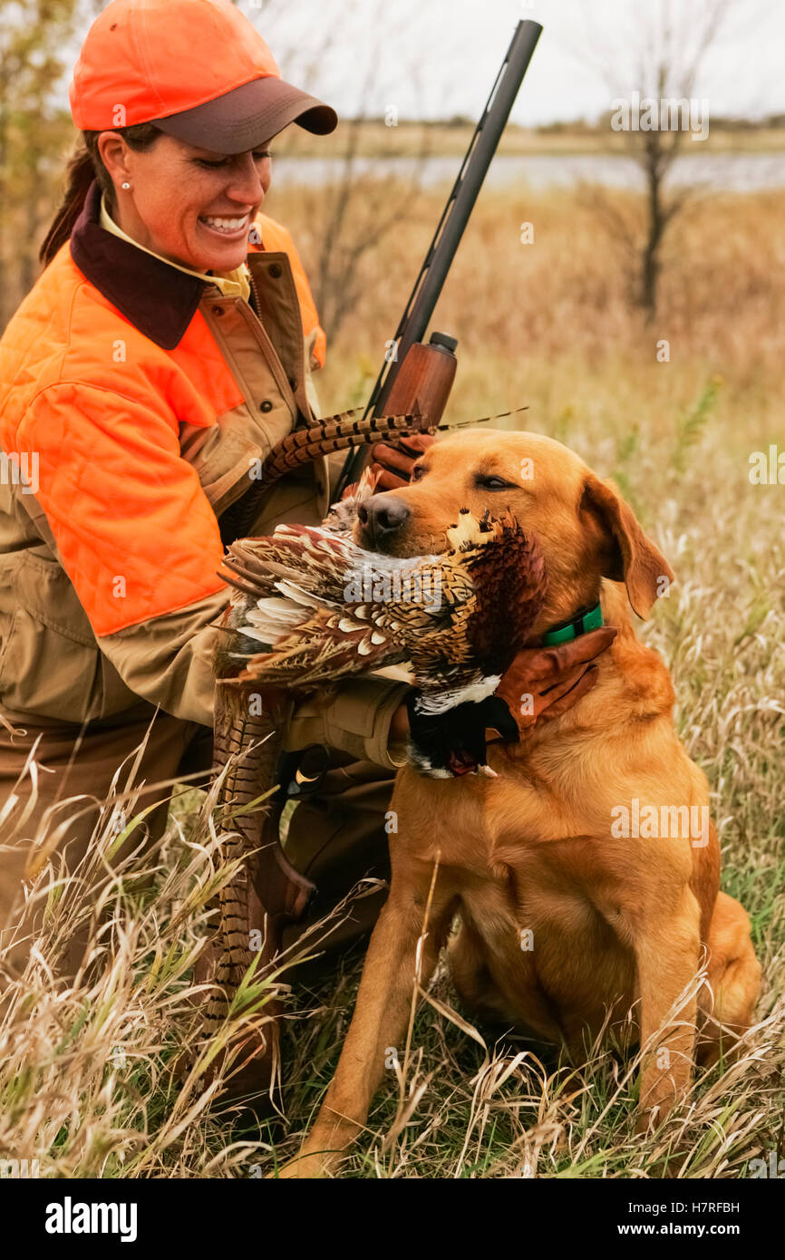 Female Upland Hunter With Rusty Lab Stock Photo, Royalty Free Image