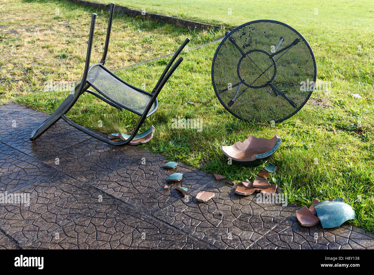 Garden Furniture Kerry blown over garden table and chairs and broken ceramic plant pot Garden Furniture Kerry blown over garden table and chairs and broken ceramic plant pot