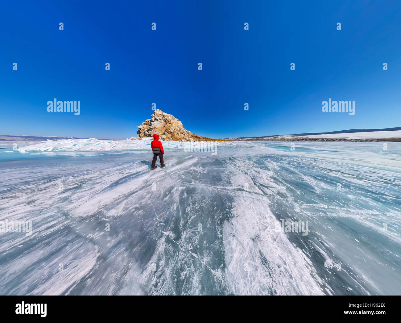 Wide Aerial View Of People At The Rock On The Ice Of Lake Baikal Stock