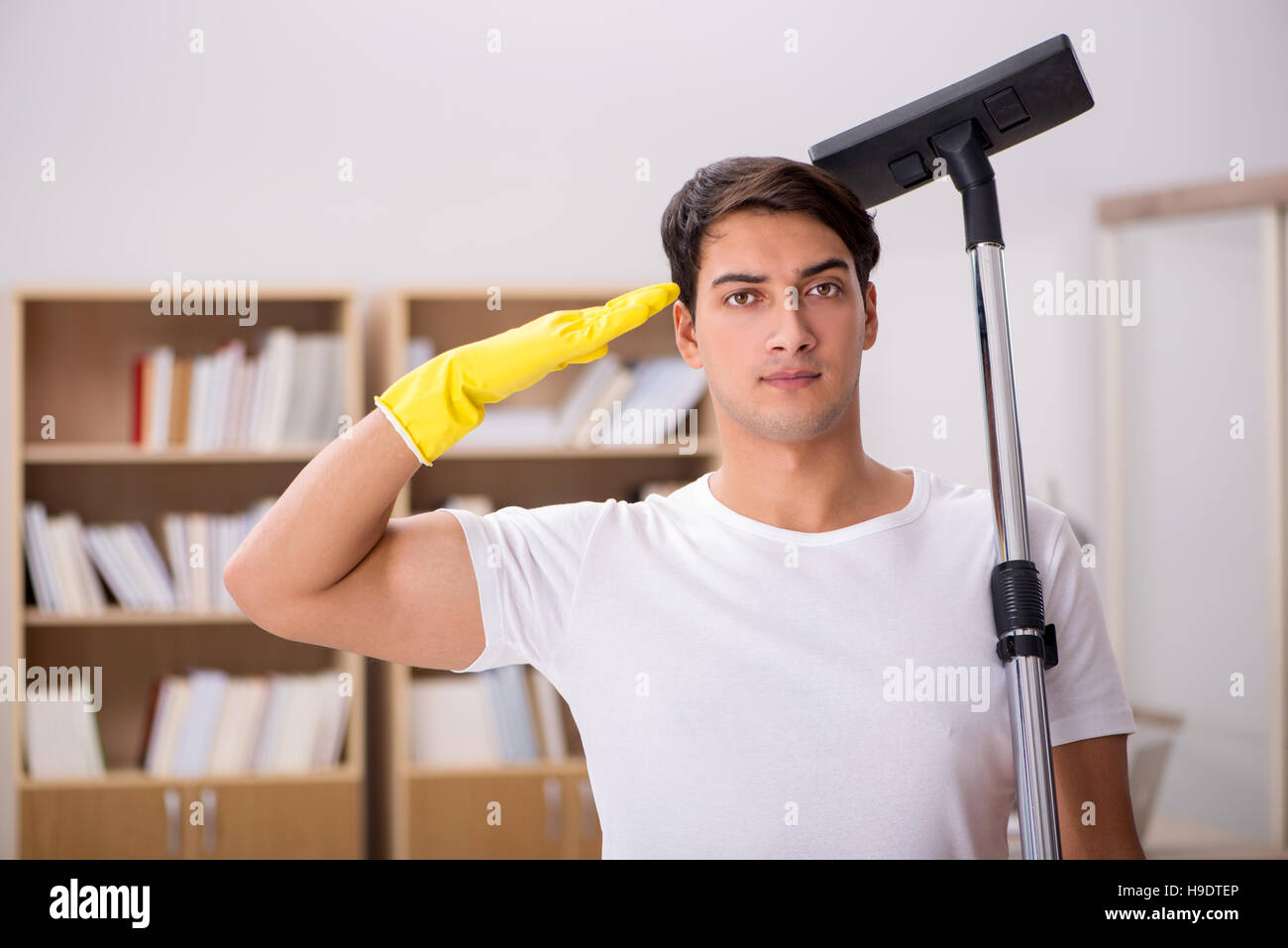 Man Cleaning Home With Vacuum Cleaner Stock Photo Alamy