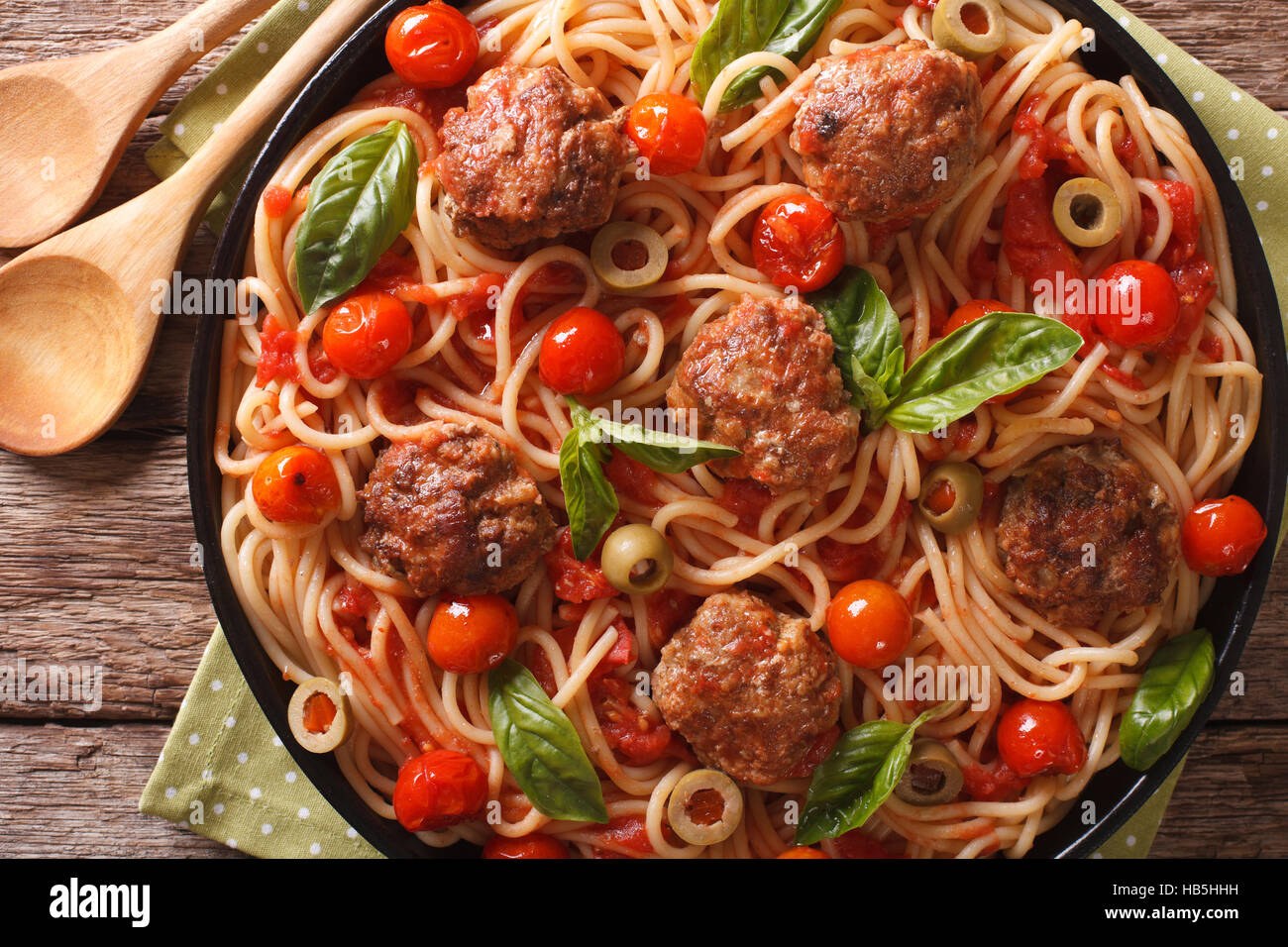 Italian Food Spaghetti With Meatballs Olives Basil And Tomato Sauce Closeup On A Plate Horizontal View From Above