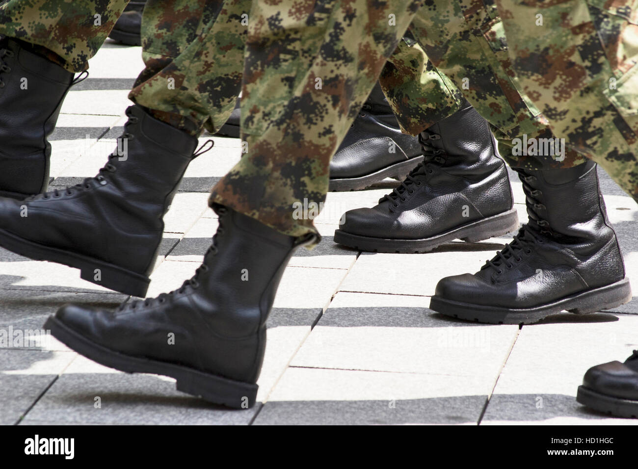 Military boots marching in formation Stock Photo, Royalty Free Image