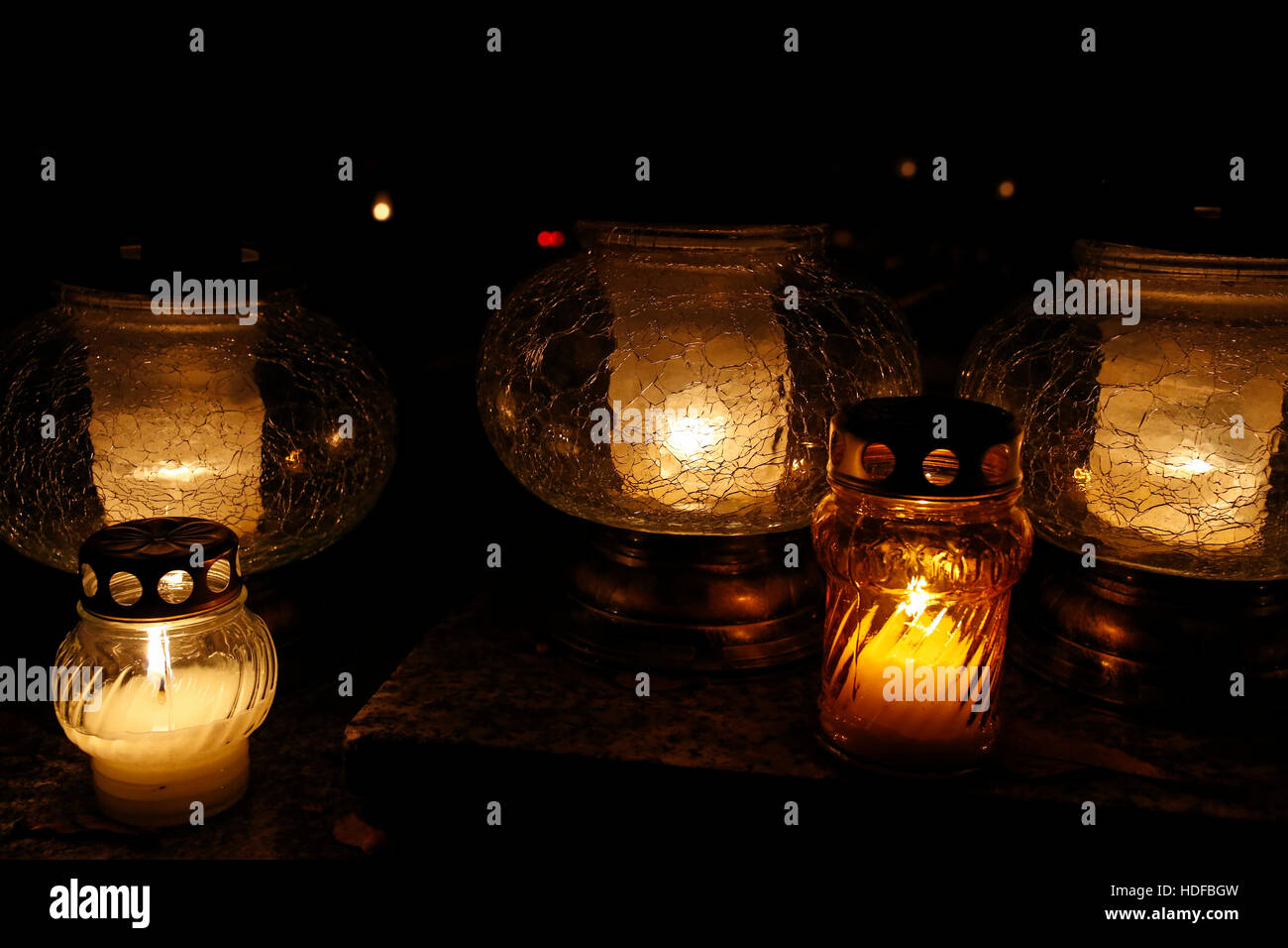 closeup of burning candles at the cemetery on All Saints' Day Stock