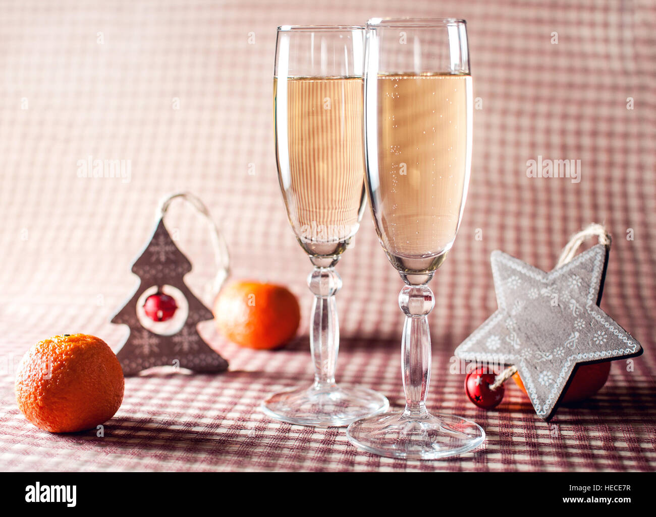 Image Of Two Wineglasses Champagne Decorative Wooden Star And Tree Mandarins On The Red Checkered Background Rustic Style Image Of Two Wineglasses Champagne Decorative Wooden Star And Tree Mandarins On The Red Checkered Background Rustic Style