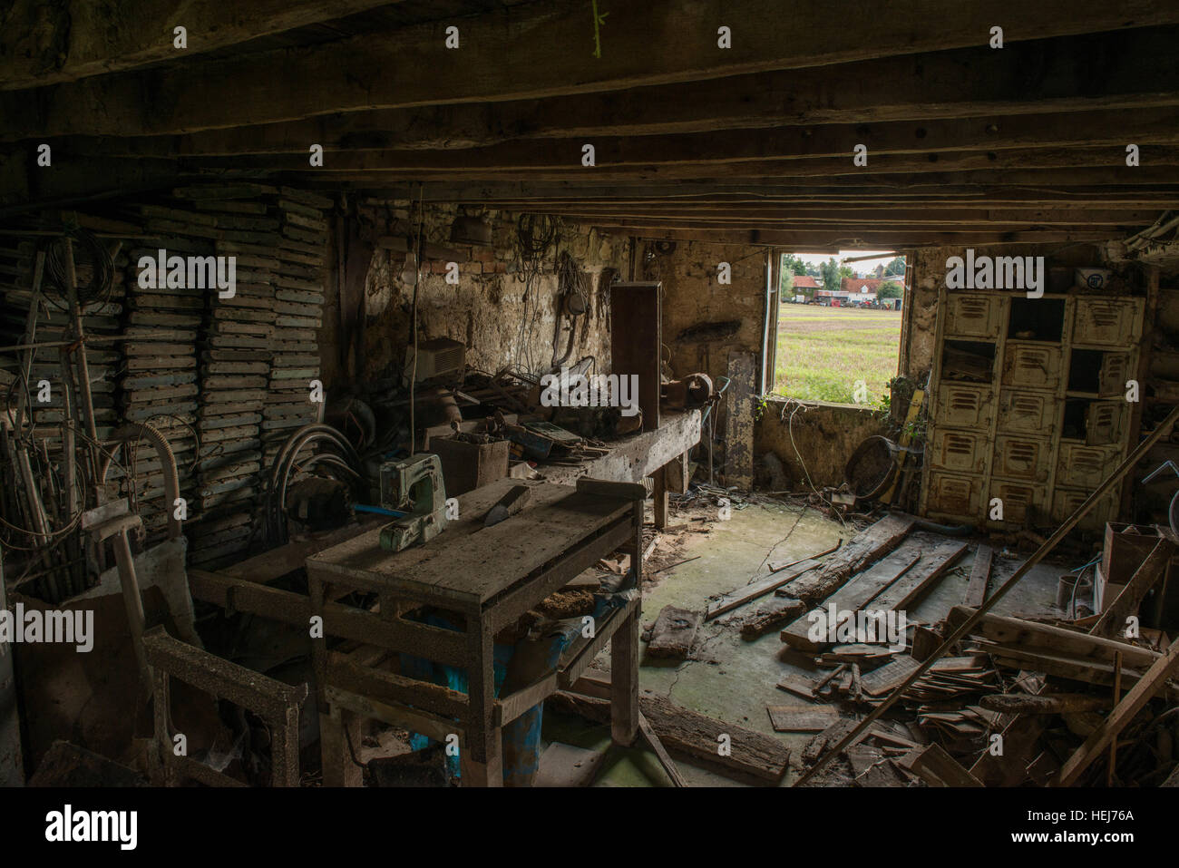 An abandoned is left to decay within a small holding in Stock
